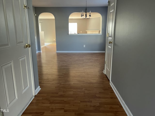 hallway featuring dark hardwood / wood-style flooring