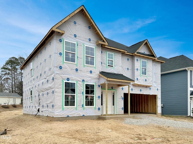 property in mid-construction featuring a garage