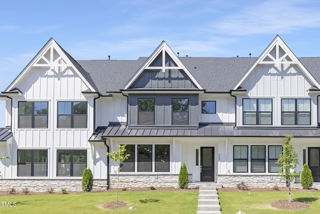 905 Myers Point Dr, Morrisville, NC 27560 - modern inspired farmhouse featuring a standing seam roof, a shingled roof, board and batten siding, and a front yard