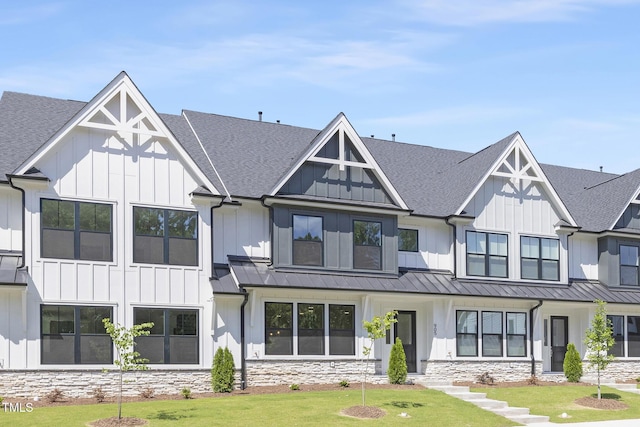 905 Myers Point Dr, Morrisville, NC 27560 - modern inspired farmhouse with board and batten siding, a standing seam roof, roof with shingles, and a front yard