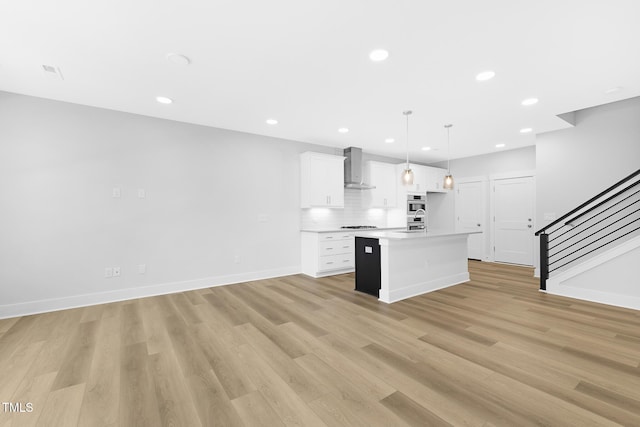905 Myers Point Dr, Morrisville, NC 27560 - kitchen featuring wall chimney exhaust hood, white cabinets, light wood finished floors, recessed lighting, and light countertops