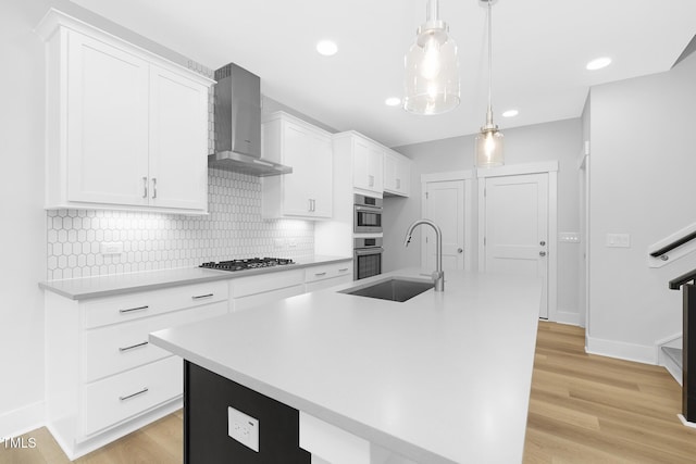 905 Myers Point Dr, Morrisville, NC 27560 - kitchen featuring wall chimney exhaust hood, stainless steel appliances, white cabinetry, tasteful backsplash, and light countertops