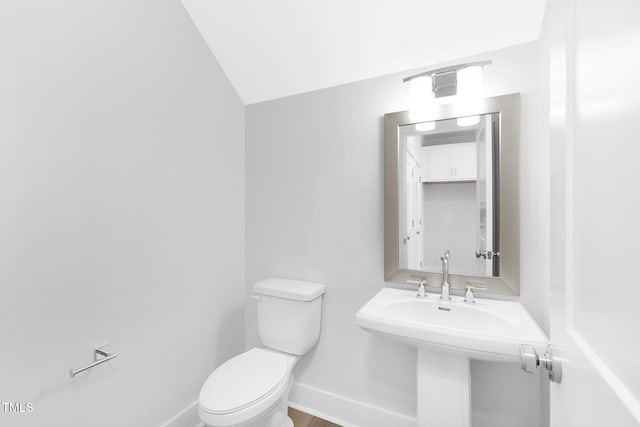 905 Myers Point Dr, Morrisville, NC 27560 - half bathroom featuring toilet and lofted ceiling