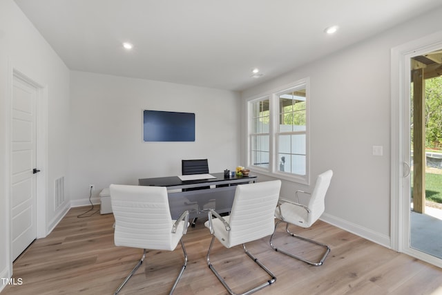 office area featuring a wealth of natural light and light hardwood / wood-style floors
