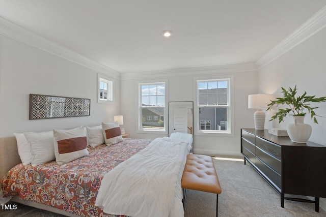 carpeted bedroom with ornamental molding