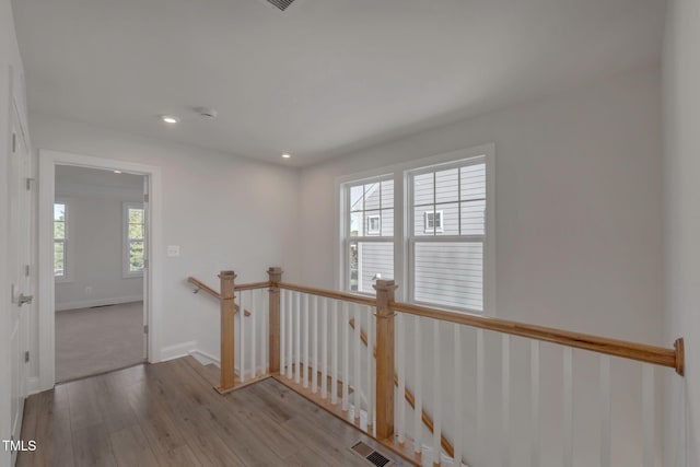 hall with light hardwood / wood-style flooring