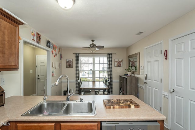 kitchen with stainless steel gas cooktop, dishwasher, sink, and ceiling fan