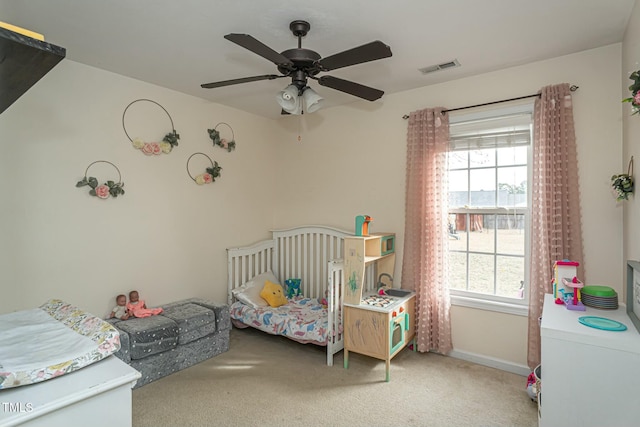 carpeted bedroom featuring ceiling fan