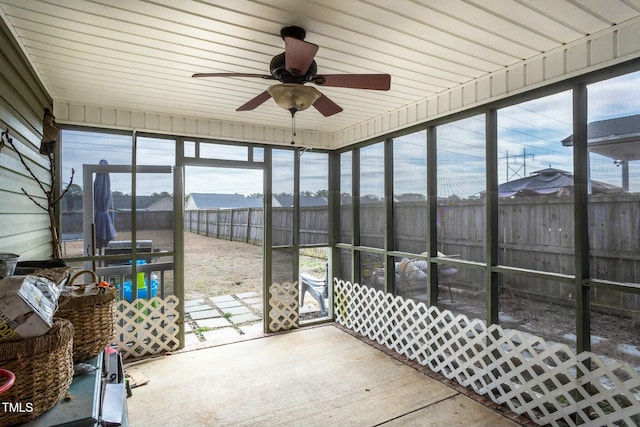 sunroom / solarium featuring ceiling fan