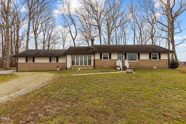 ranch-style house with a front lawn