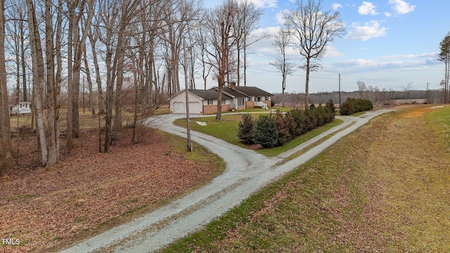 exterior space with a garage and a front yard