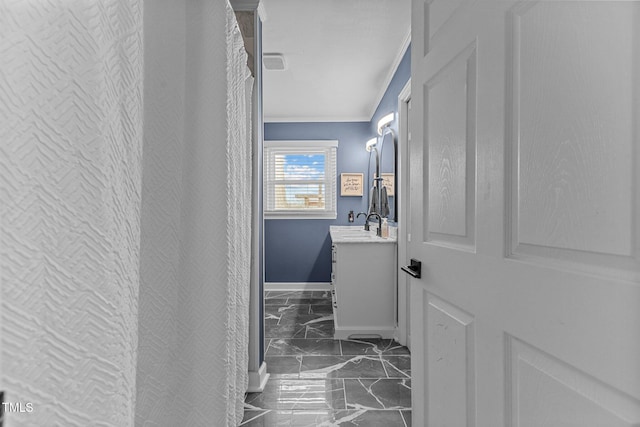 bathroom featuring vanity and crown molding