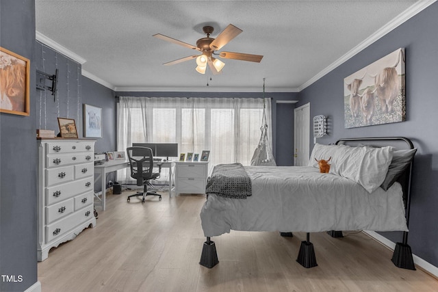 bedroom with ceiling fan, ornamental molding, a textured ceiling, and light wood-type flooring