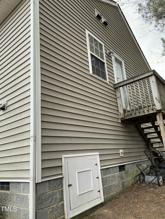 view of side of home with crawl space