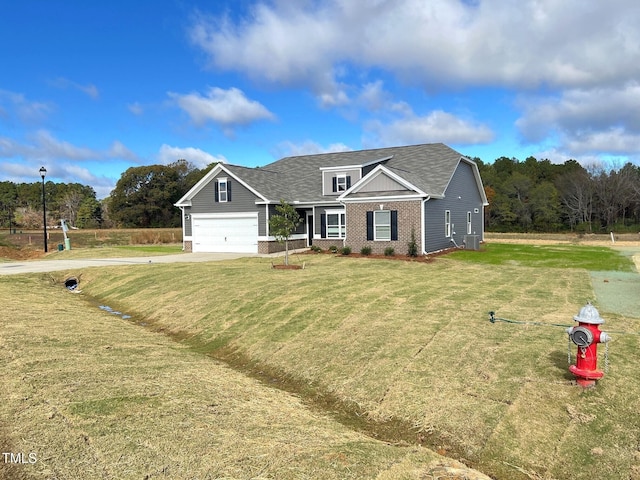 view of front facade with a garage and a front yard