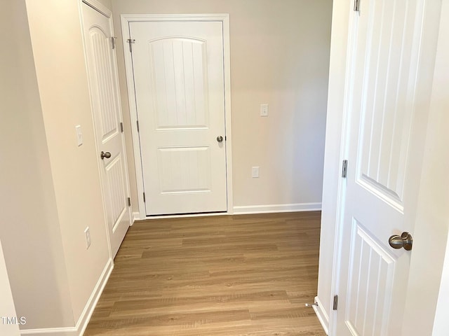 hall with light hardwood / wood-style flooring