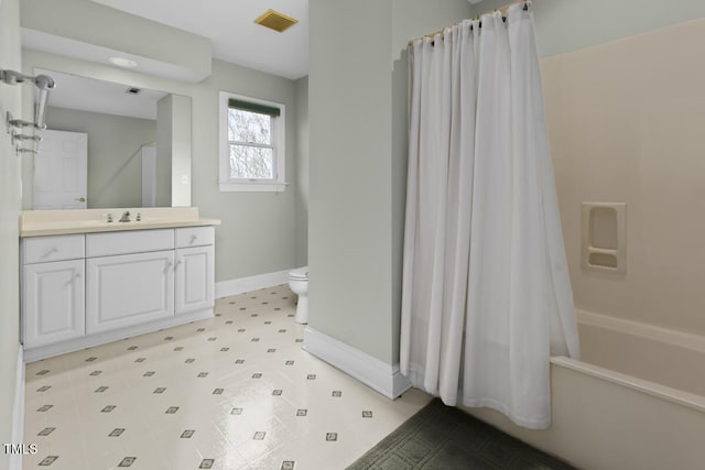 full bathroom featuring vanity, shower / bathtub combination with curtain, and toilet