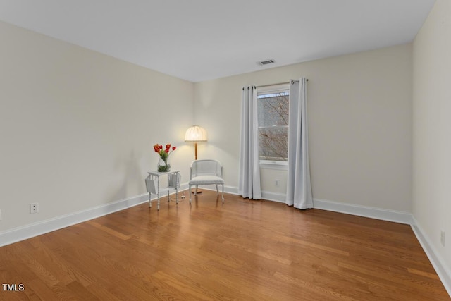 unfurnished room featuring hardwood / wood-style floors