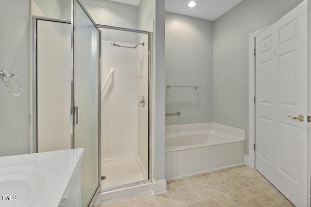 bathroom with plus walk in shower and vanity