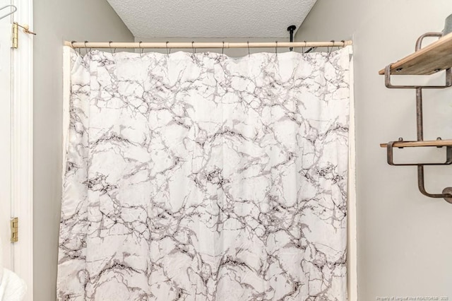 bathroom with a textured ceiling