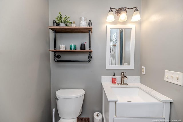 bathroom featuring vanity and toilet