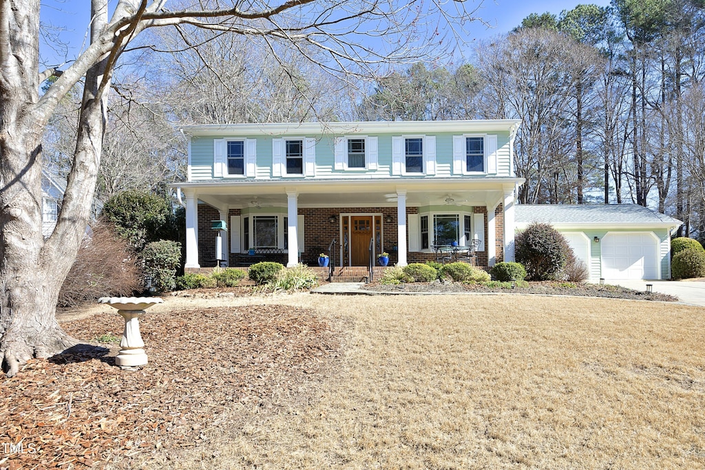 view of front of property featuring a garage and covered porch