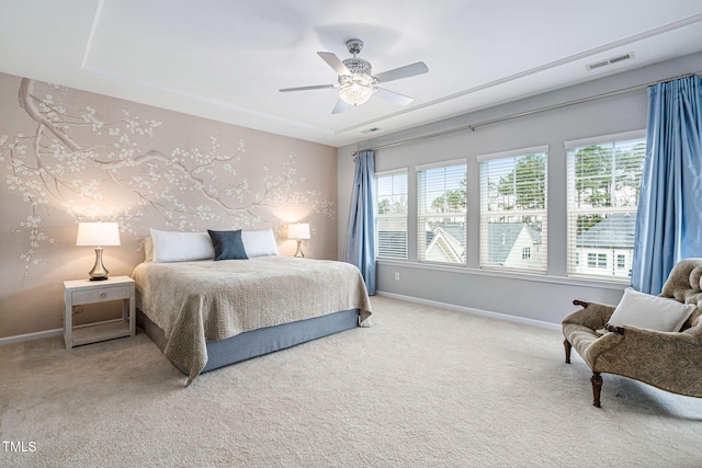 bedroom with multiple windows, carpet, and baseboards