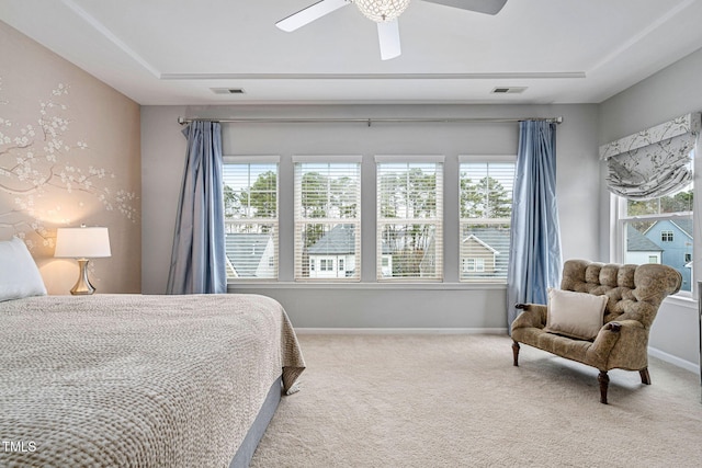 carpeted bedroom with multiple windows, baseboards, and visible vents