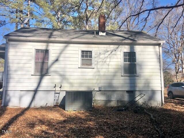 view of side of property with cooling unit