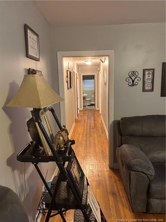 201 S Elm St, Maxton, NC 28364 - hall featuring light wood finished floors and baseboards