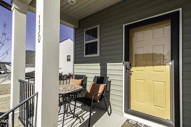 doorway to property featuring covered porch