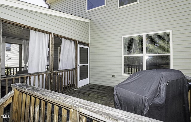 wooden terrace featuring grilling area