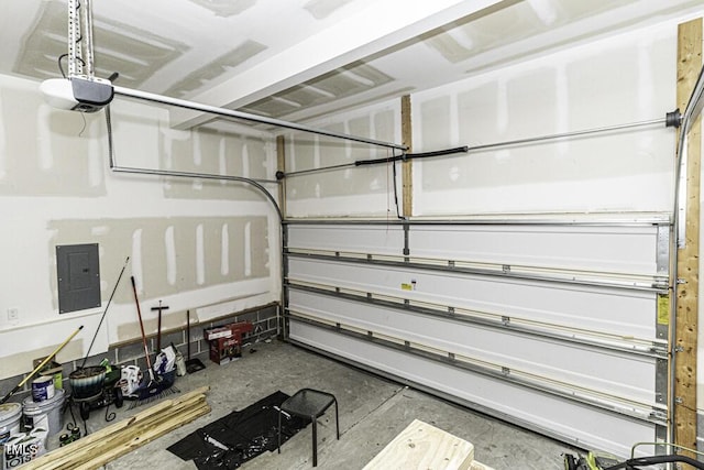 garage featuring a garage door opener and electric panel