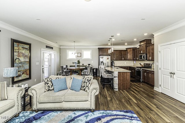 living room featuring crown molding, dark hardwood / wood-style floors, and sink