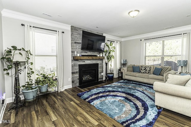 living room with crown molding, a fireplace, and dark hardwood / wood-style flooring