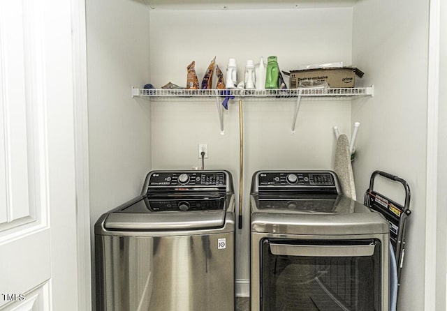 laundry room featuring separate washer and dryer