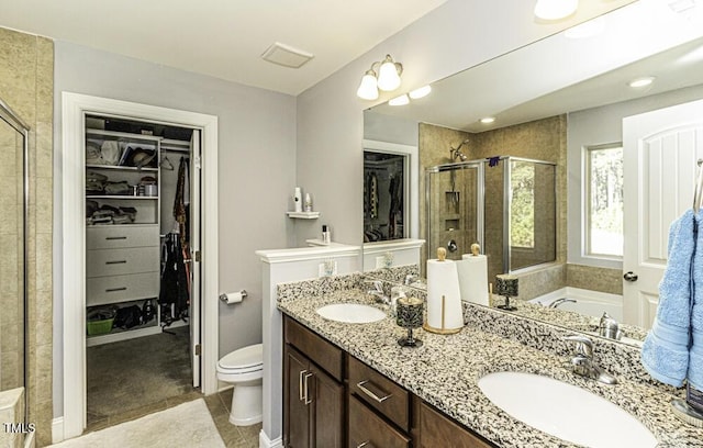 full bathroom with toilet, tile patterned floors, vanity, and shower with separate bathtub