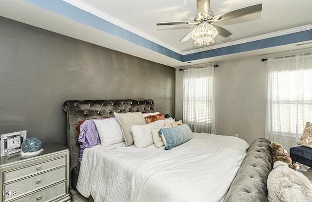 bedroom with multiple windows and ornamental molding