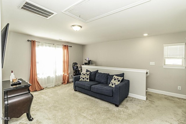 living room with a healthy amount of sunlight and light carpet