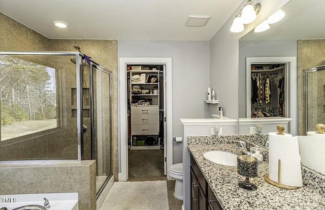 full bathroom with independent shower and bath, vanity, and toilet