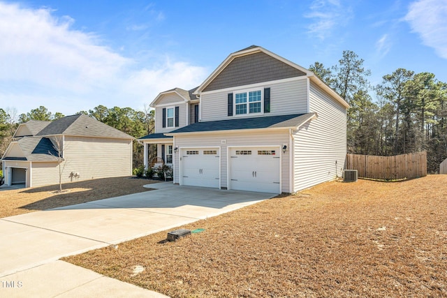 view of front of house with central AC and a garage