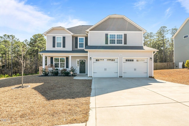 view of front facade with a garage and covered porch