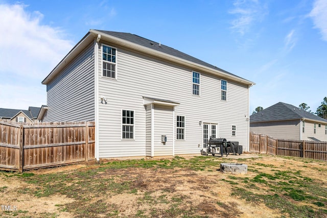 back of property featuring a fire pit