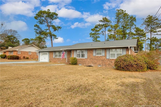 ranch-style home with a garage and a front lawn