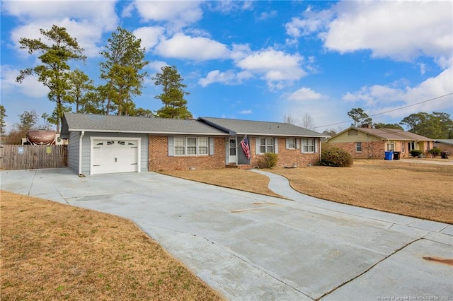 single story home with a garage and a front yard