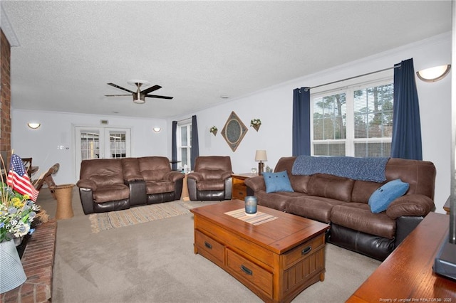 living room with ceiling fan, light colored carpet, a textured ceiling, and french doors