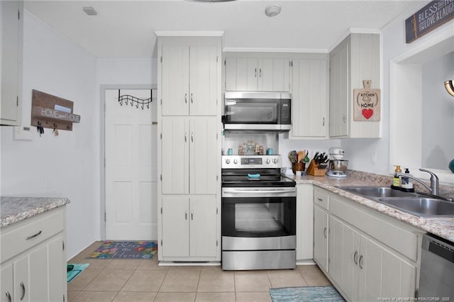 kitchen featuring white cabinetry, sink, and stainless steel appliances