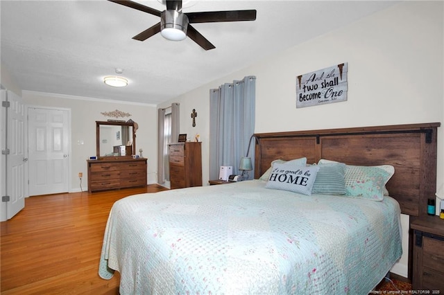 bedroom with ceiling fan and wood-type flooring