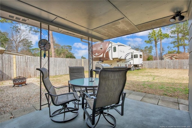 view of patio / terrace with an outdoor fire pit