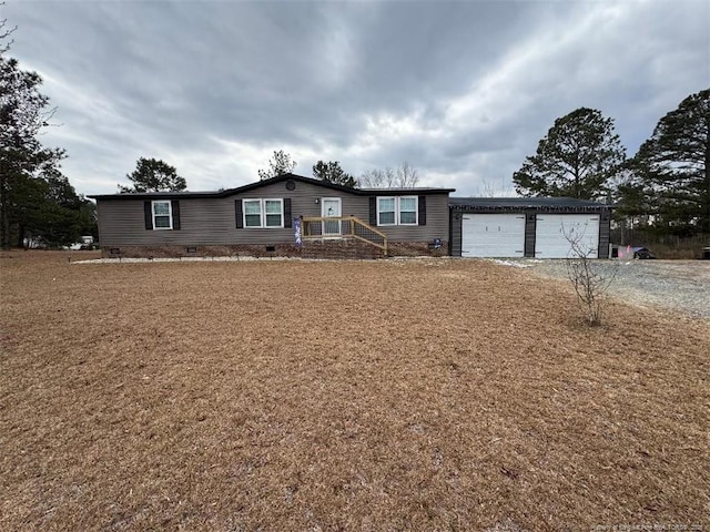 ranch-style home featuring a garage